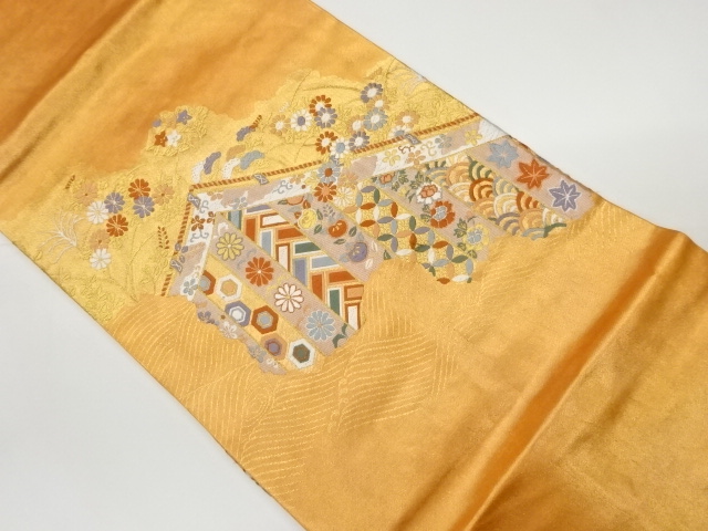 幔幕に草花・古典柄模様織出し名古屋帯